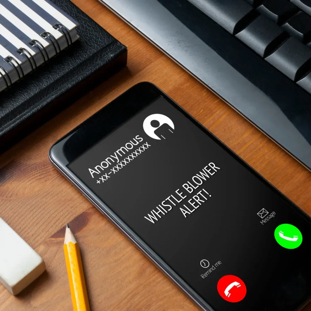 Phone showing a whistle blower alert